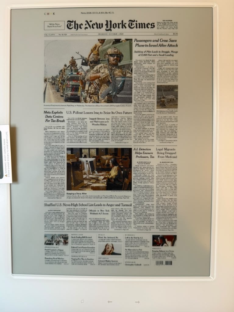 The first New York Times front page rendered on the E1004 display.